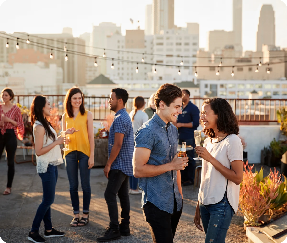 Group socializing on urban rooftop terrace